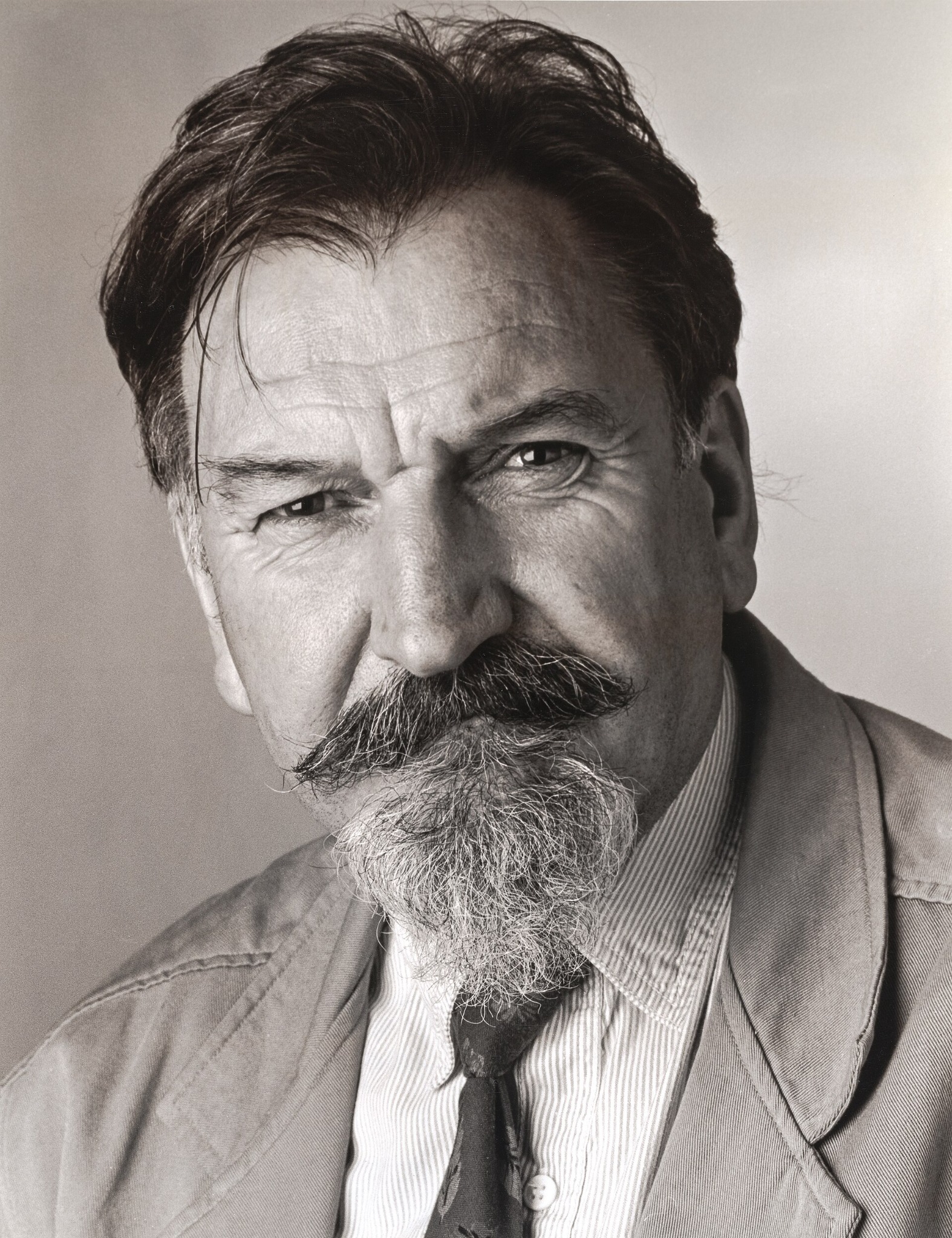 Authentic black-and-white portrait of John Coley, with dark hair and a moustache.